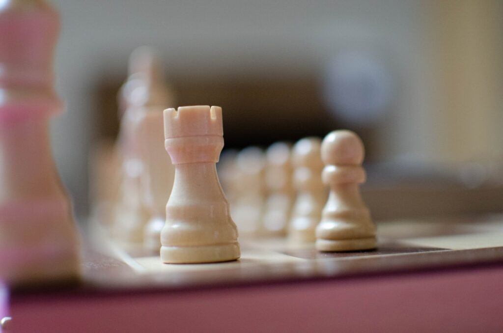 a group of chess pieces sitting on top of a table